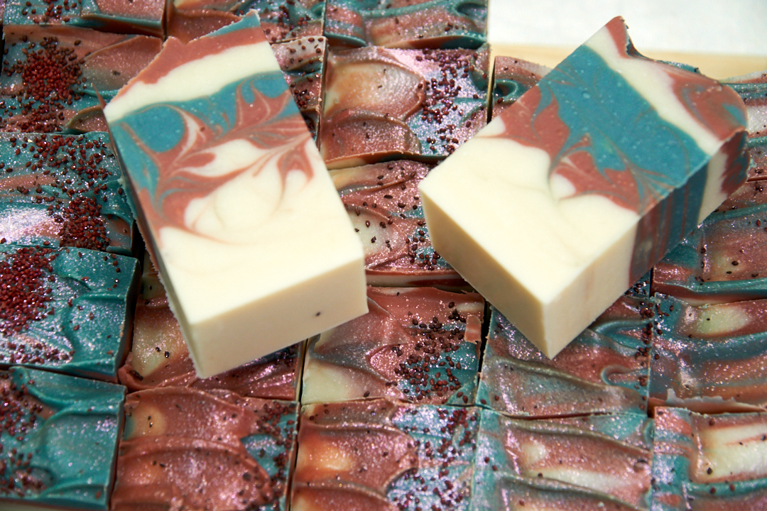 A beautifully crafted bar of Cranberry Fig Soap with vibrant colors and a festive design, showcasing its natural ingredients and eco-friendly glitter.