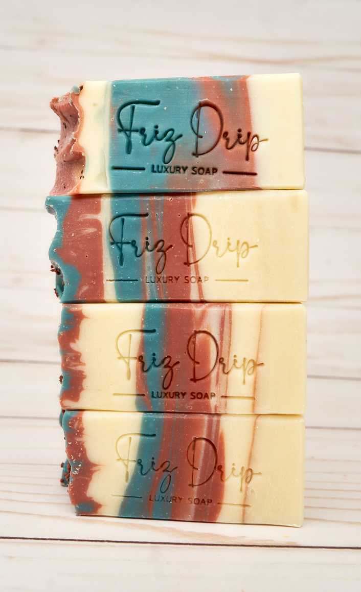 A beautifully crafted bar of Cranberry Fig Soap with vibrant colors and a festive design, showcasing its natural ingredients and eco-friendly glitter.