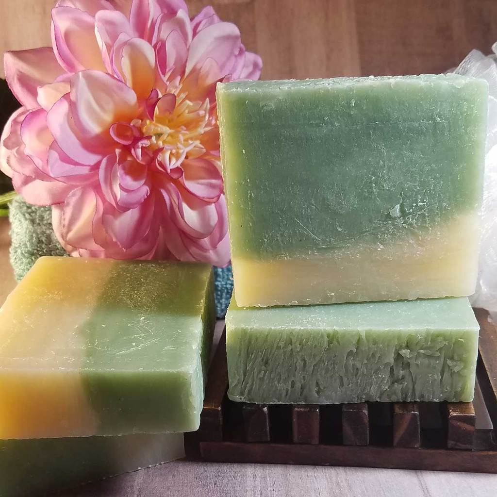 Cucumber and Melon Handmade Soap bar with fresh cucumber and melon slices, showcasing its vibrant colors and natural ingredients.