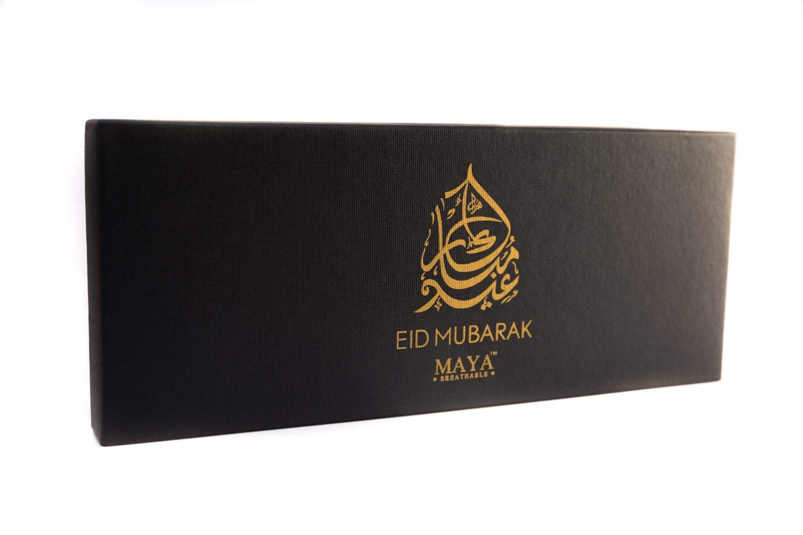 Elegant 6-piece Eid gift set by MAYA in a luxurious black box with gold logo and Eid Mubarak design.