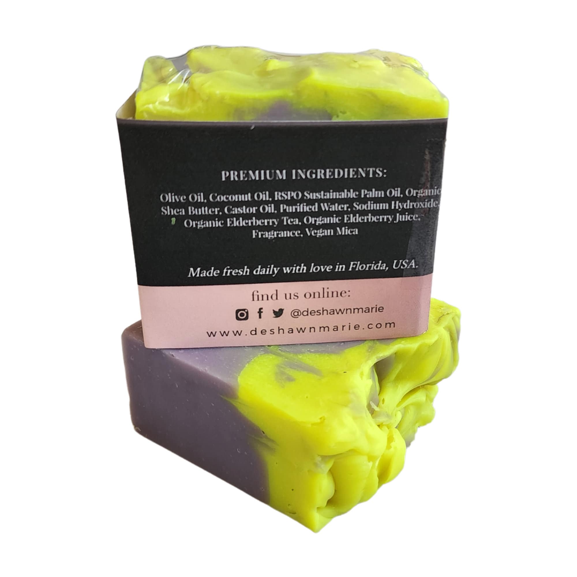 Elderberry Magnolia Soap bar with vibrant berry and floral design, showcasing its handcrafted quality.