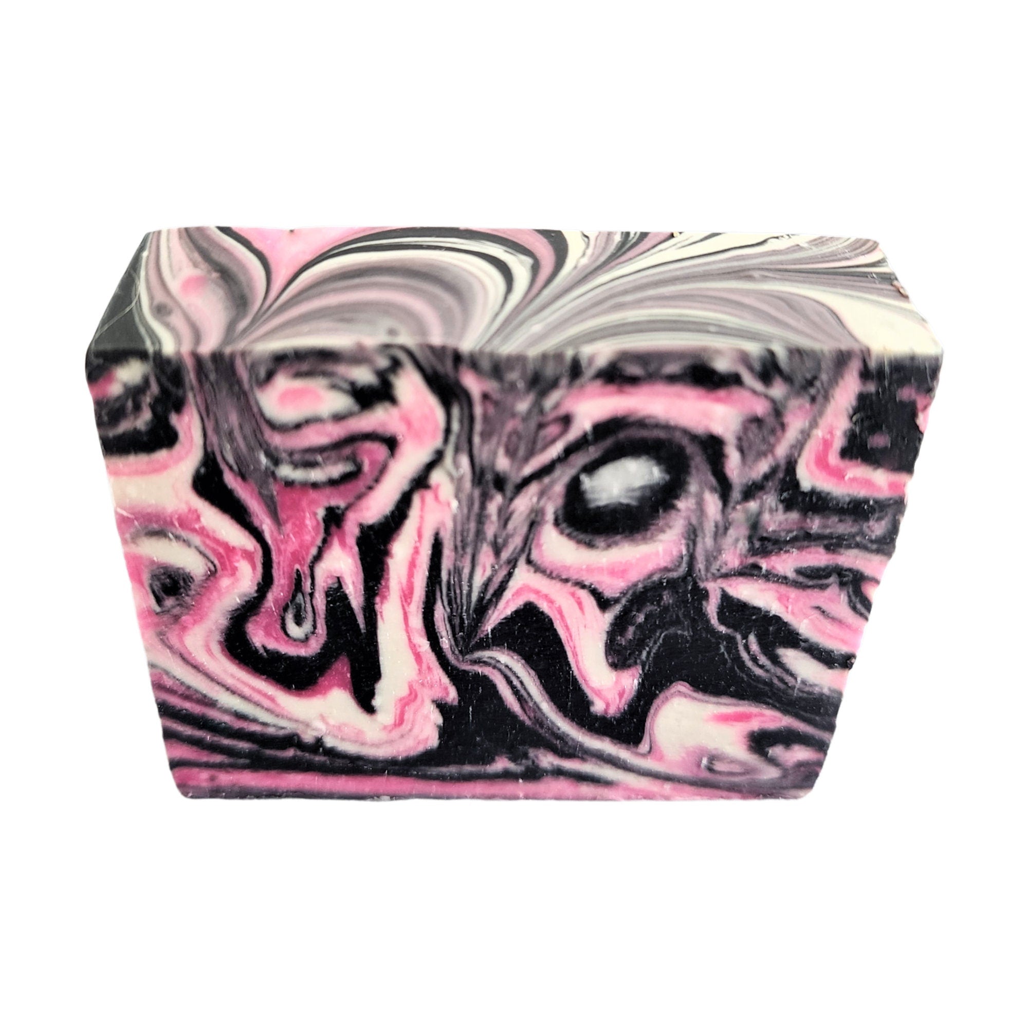 A beautifully crafted Frankincense Sandalwood Soap bar featuring pink, black, and white swirls, showcasing its unique design and vegan ingredients.