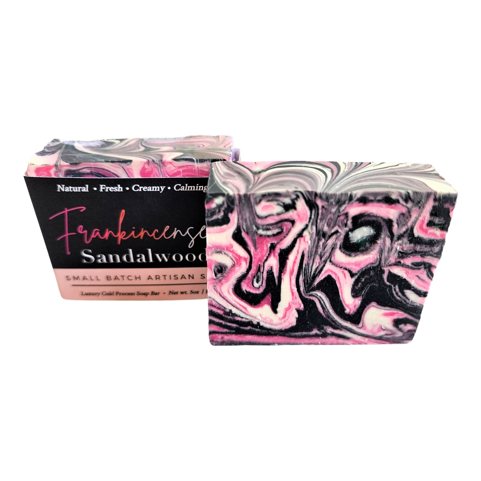 A beautifully crafted Frankincense Sandalwood Soap bar featuring pink, black, and white swirls, showcasing its unique design and vegan ingredients.