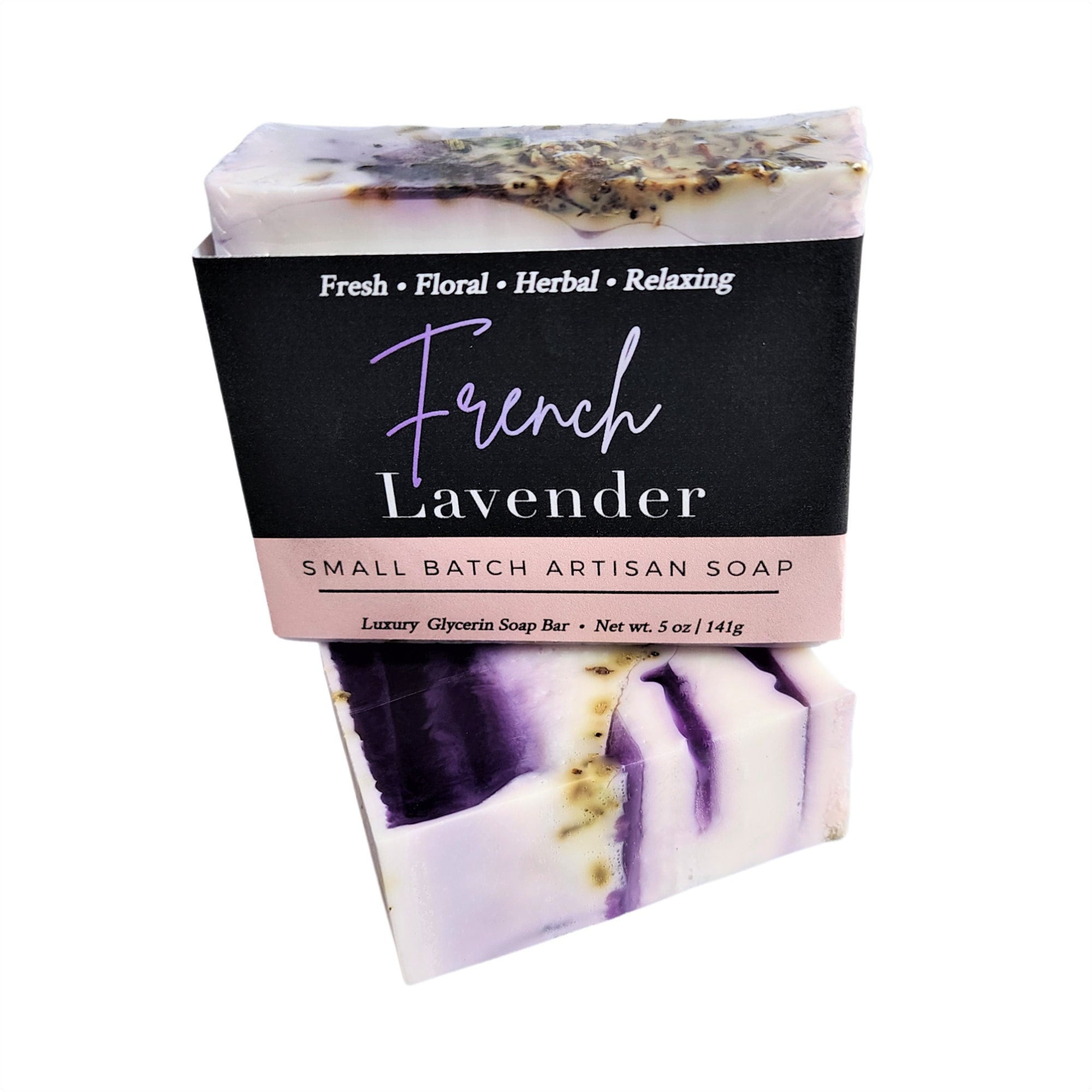 A beautifully crafted bar of French Lavender Soap with dried lavender flowers embedded, showcasing its rich purple hue and artisanal quality.