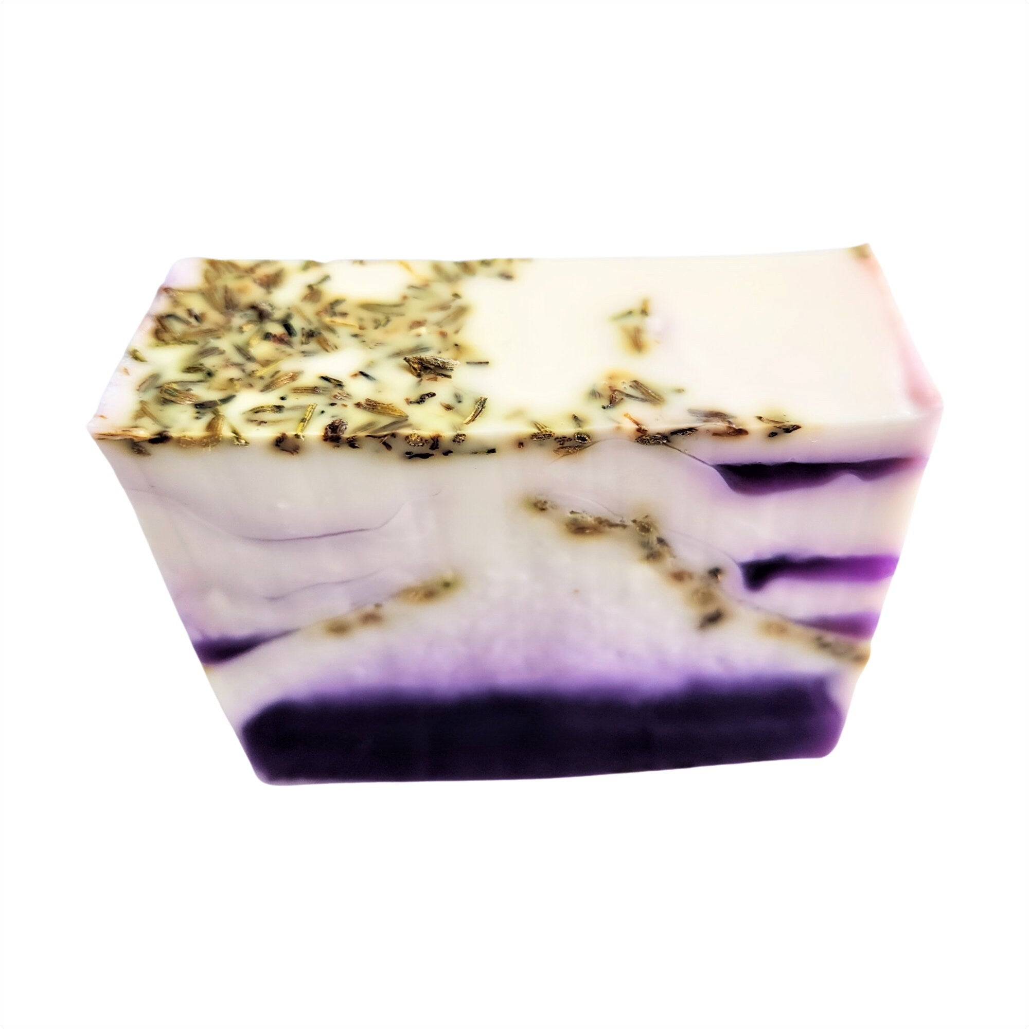 A beautifully crafted bar of French Lavender Soap with dried lavender flowers embedded, showcasing its rich purple hue and artisanal quality.