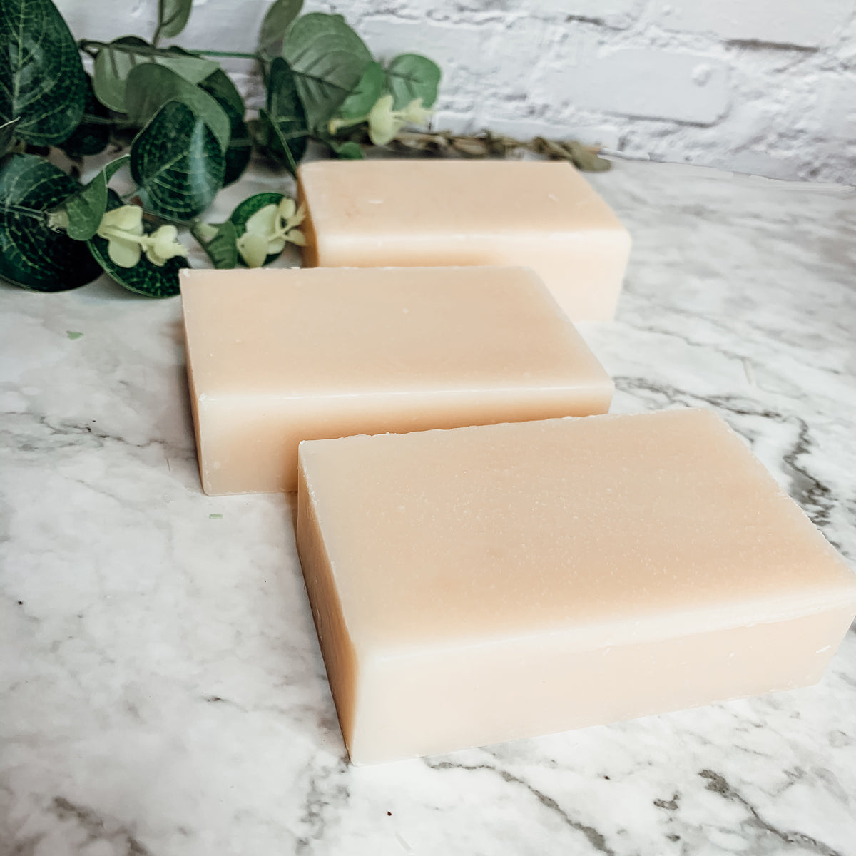 Ginger White Tea Aloe soap bar with natural ingredients, showcasing its unique design and texture.