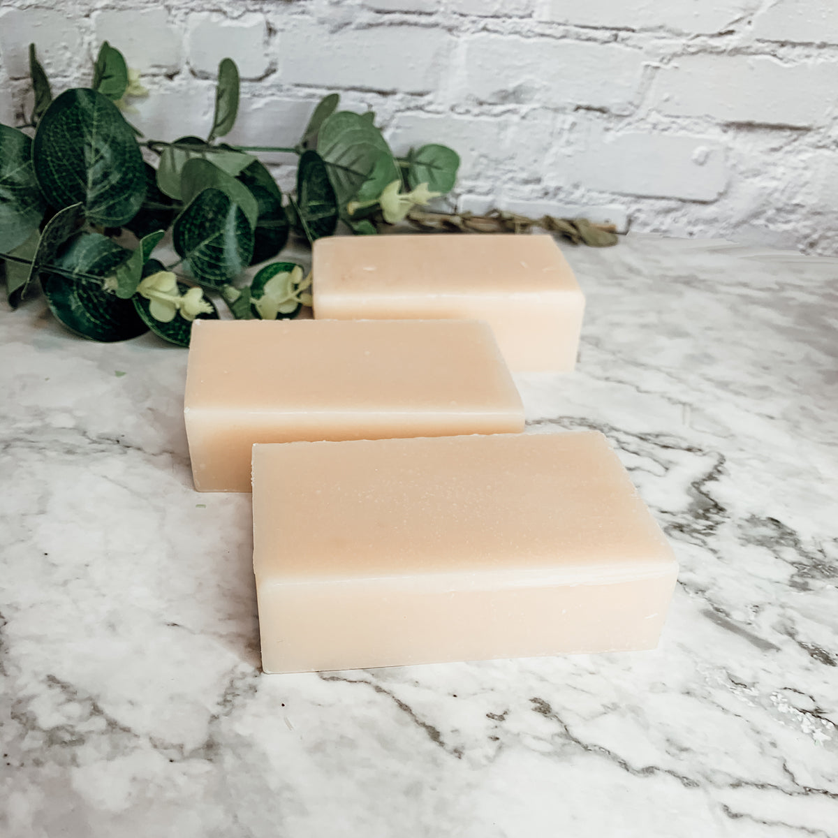 Ginger White Tea Aloe soap bar with natural ingredients, showcasing its unique design and texture.