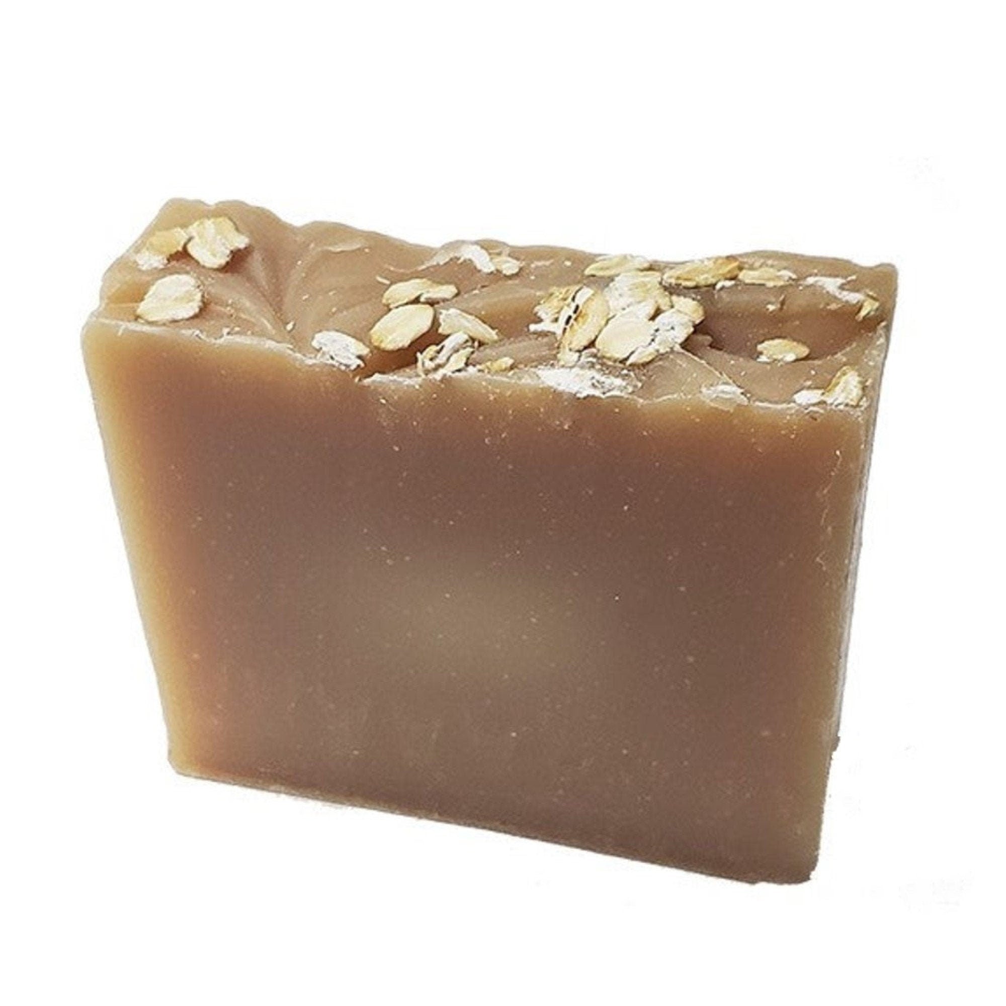 A rustic Honey Oat Soap bar featuring a light honey color and visible oat flakes, wrapped in eco-friendly packaging.