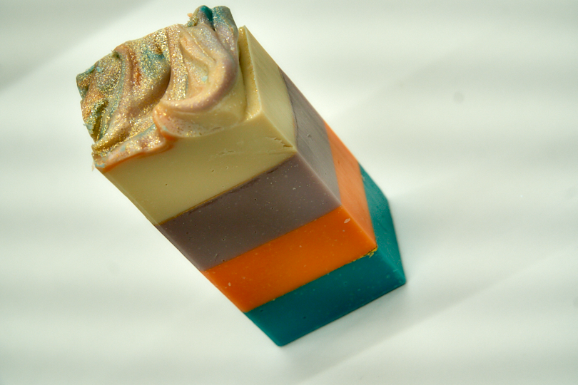 A vibrant bar of Island Margarita Soap featuring tropical colors and a refreshing citrus scent, ideal for luxurious bathing.