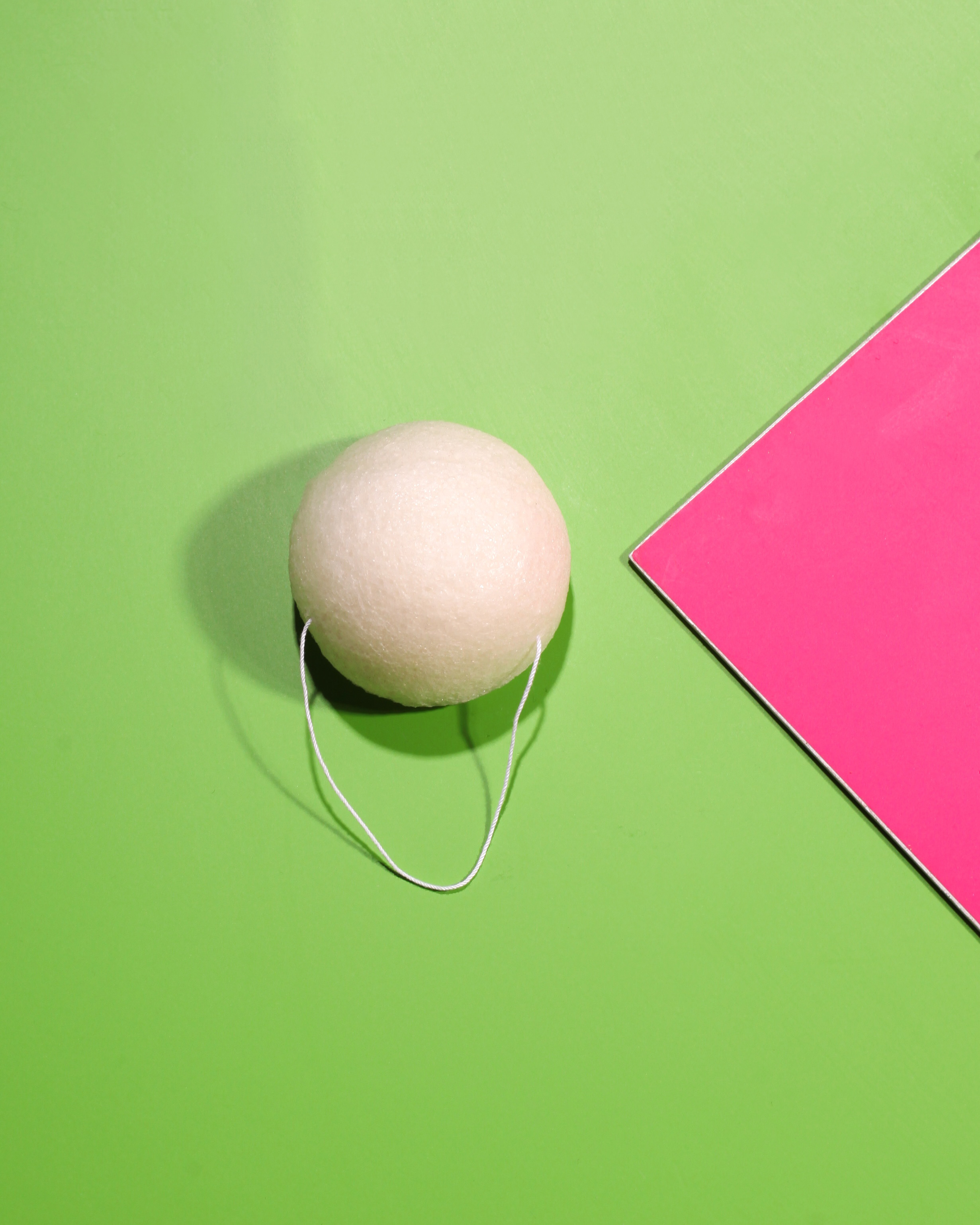 Konjac sponge on green background.