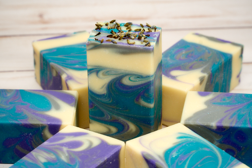 Lavender Martini Soap bar with lavender buds and citrus notes, showcasing its handcrafted quality and elegant design.