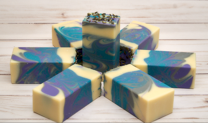 Lavender Martini Soap bar with lavender buds and citrus notes, showcasing its handcrafted quality and elegant design.