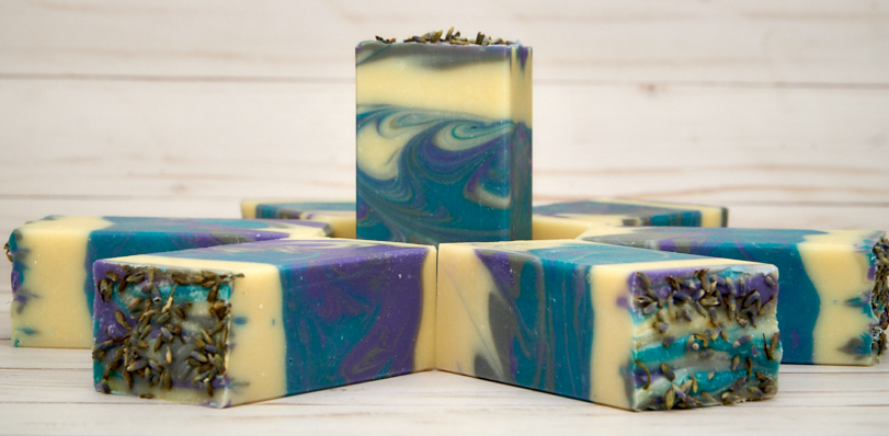 Lavender Martini Soap bar with lavender buds and citrus notes, showcasing its handcrafted quality and elegant design.