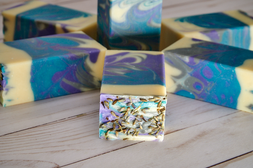 Lavender Martini Soap bar with lavender buds and citrus notes, showcasing its handcrafted quality and elegant design.