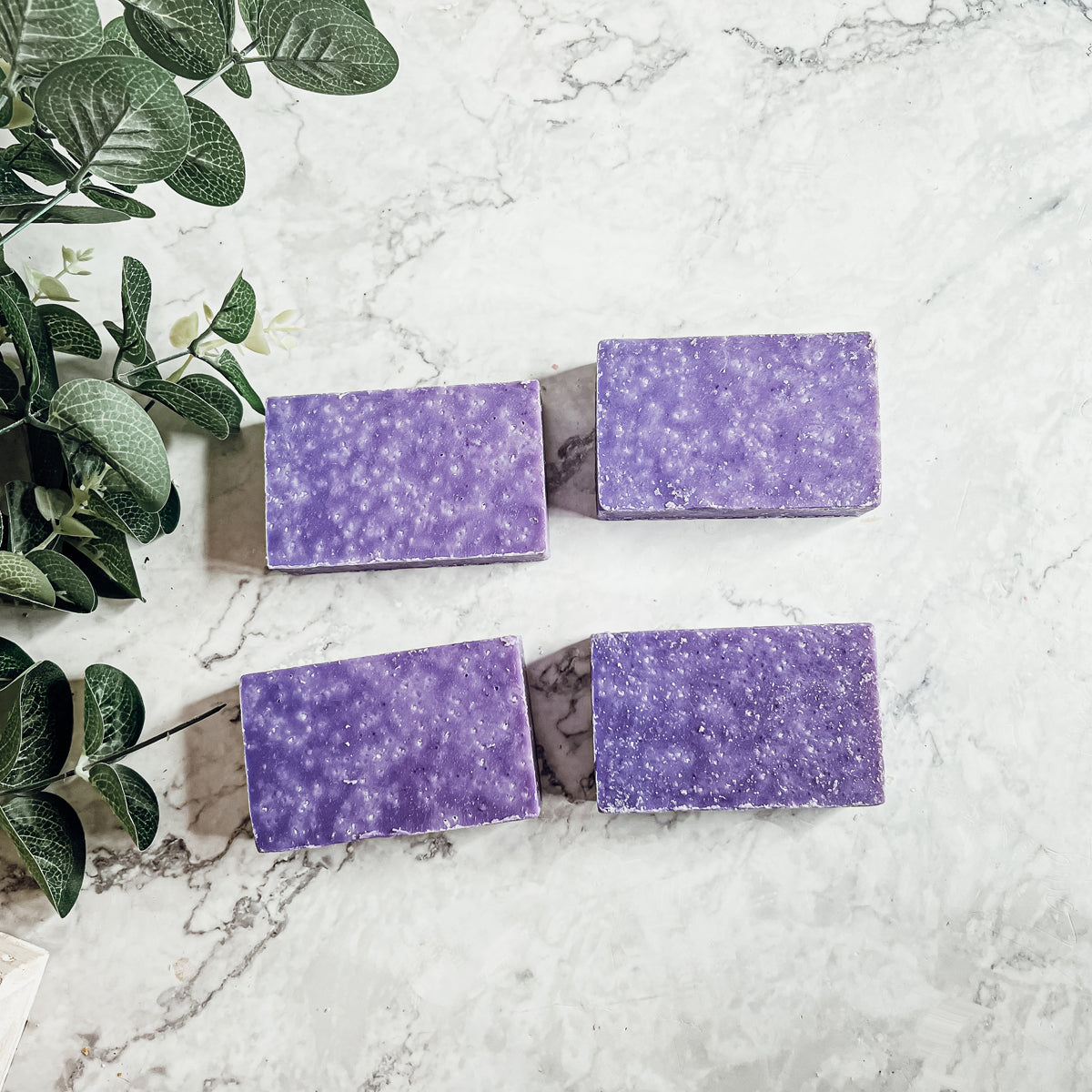 Lavender & Oakmoss Scrub bar showcasing its natural ingredients and unique design, perfect for gentle exfoliation.