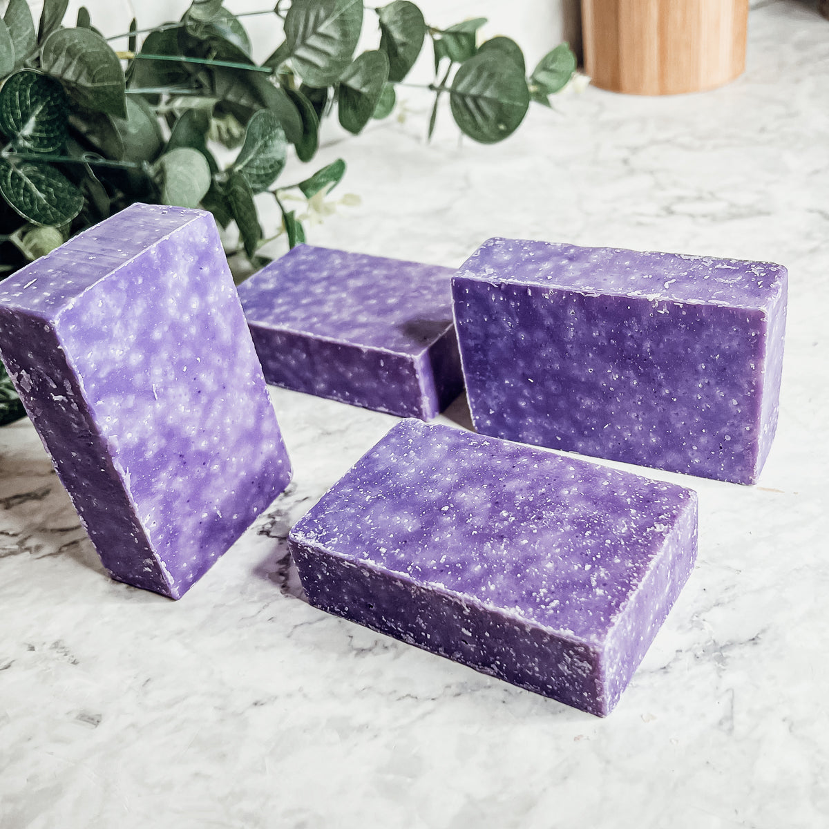 Lavender & Oakmoss Scrub bar showcasing its natural ingredients and unique design, perfect for gentle exfoliation.