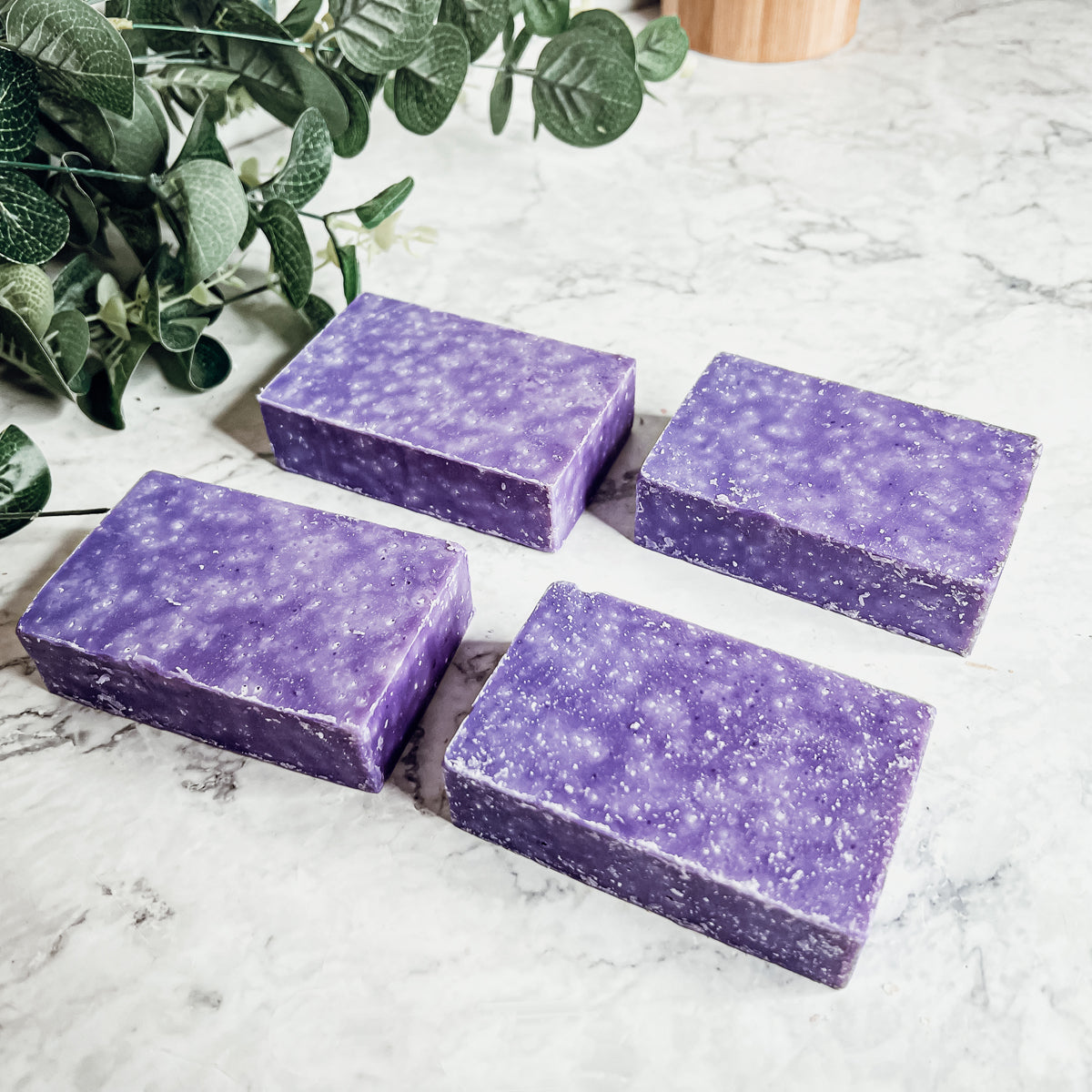 Lavender & Oakmoss Scrub bar showcasing its natural ingredients and unique design, perfect for gentle exfoliation.