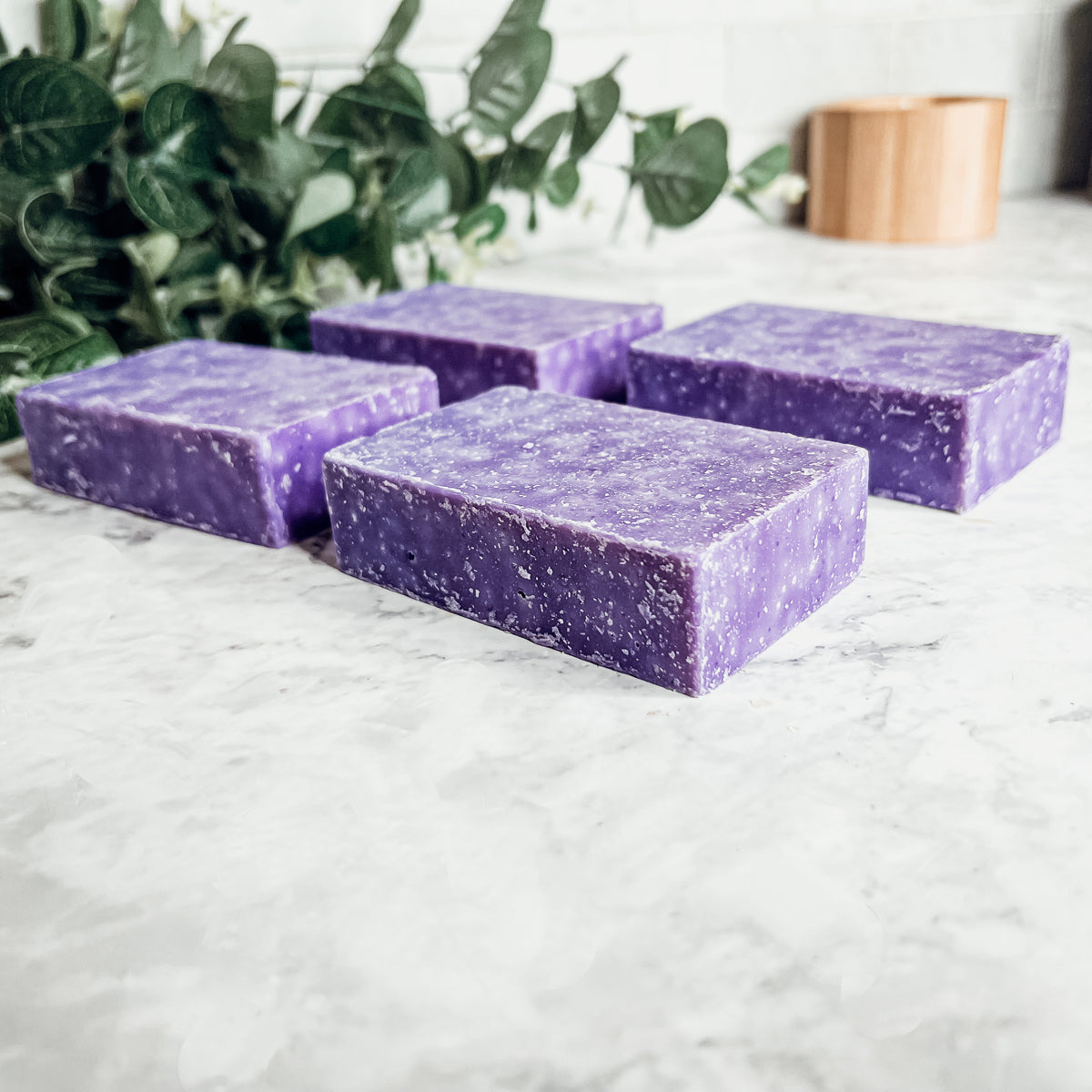 Lavender & Oakmoss Scrub bar showcasing its natural ingredients and unique design, perfect for gentle exfoliation.