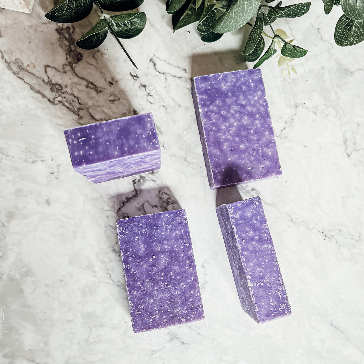 Lavender & Oakmoss Scrub bar showcasing its natural ingredients and unique design, perfect for gentle exfoliation.