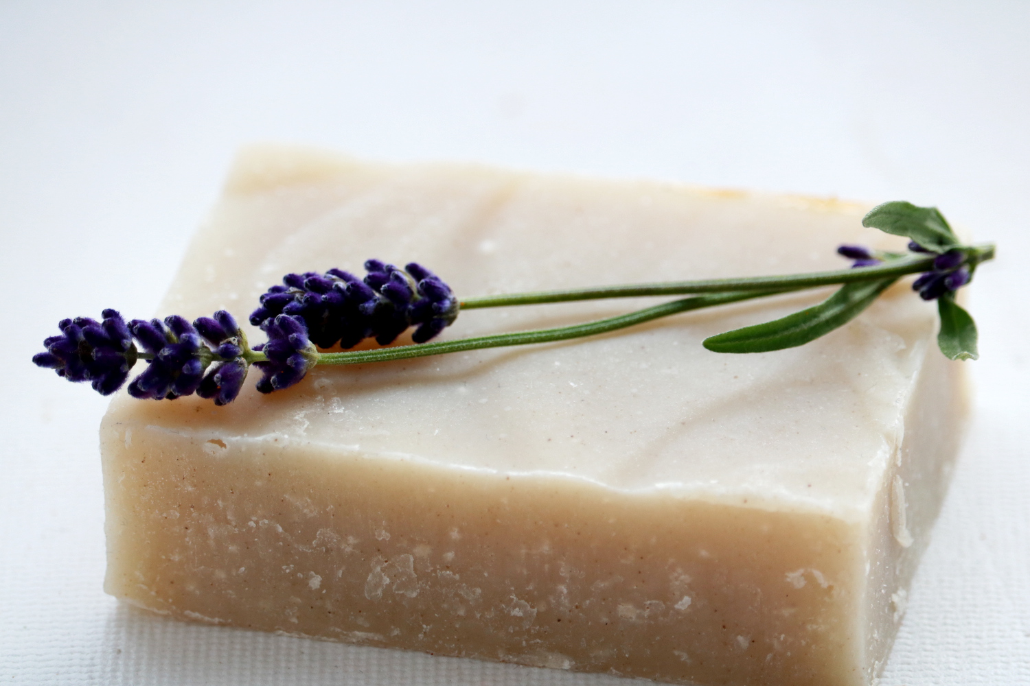 A Lavender Rosemary Shampoo Bar, eco-friendly and suitable for all hair types, featuring a rich purple color with natural ingredients.