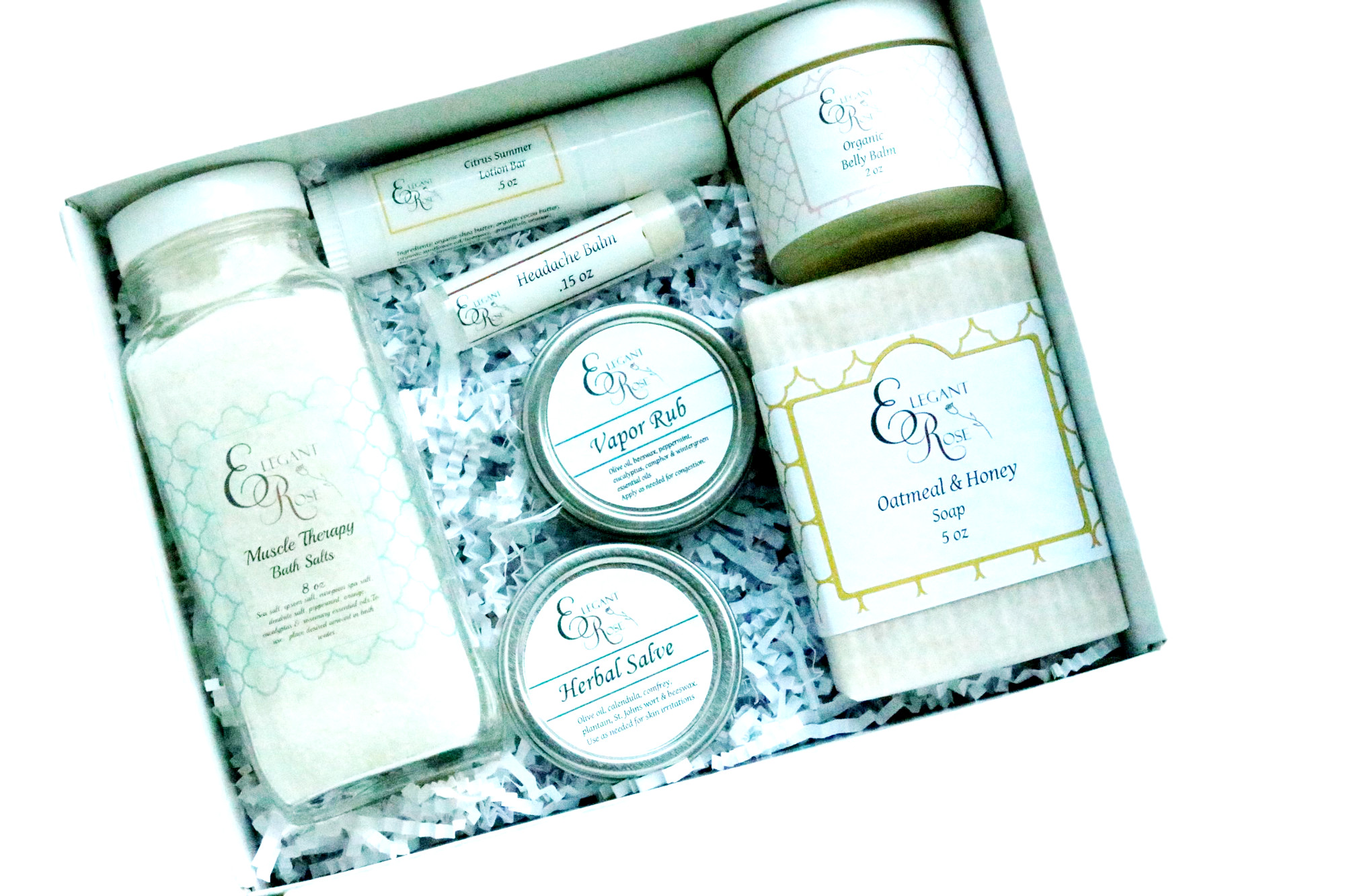 New Mom Gift Set featuring bath salt, belly balm, oatmeal soap, herbal salve, vapor rub, headache balm, and lotion bar in a stylish gift box.