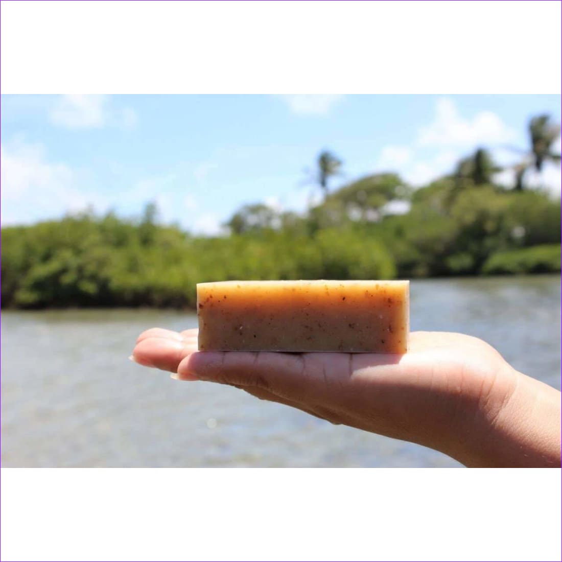 Hand holding a soap bar.