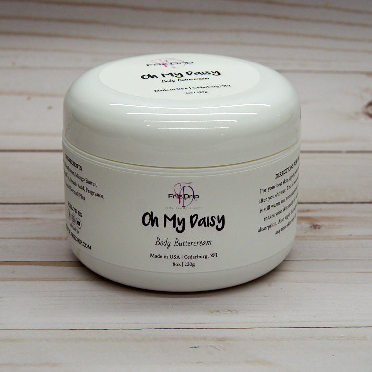 Oh My Daisy Body Cream in an elegant jar, showcasing its creamy texture and floral design.