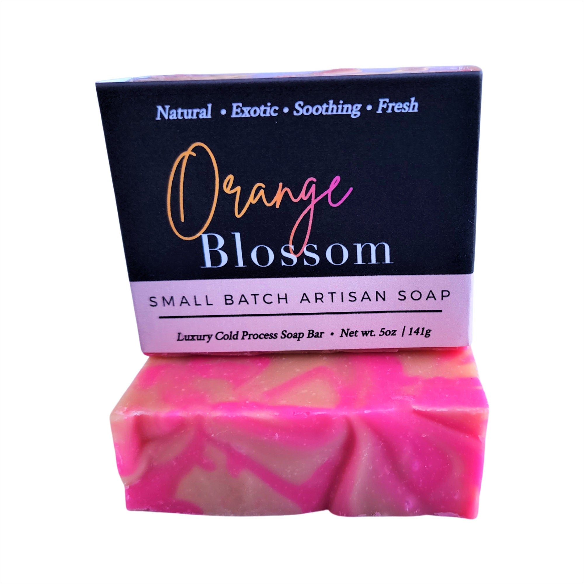 A vibrant Orange Blossom Soap bar with pink and orange swirls, showcasing its handcrafted design and tropical essence.