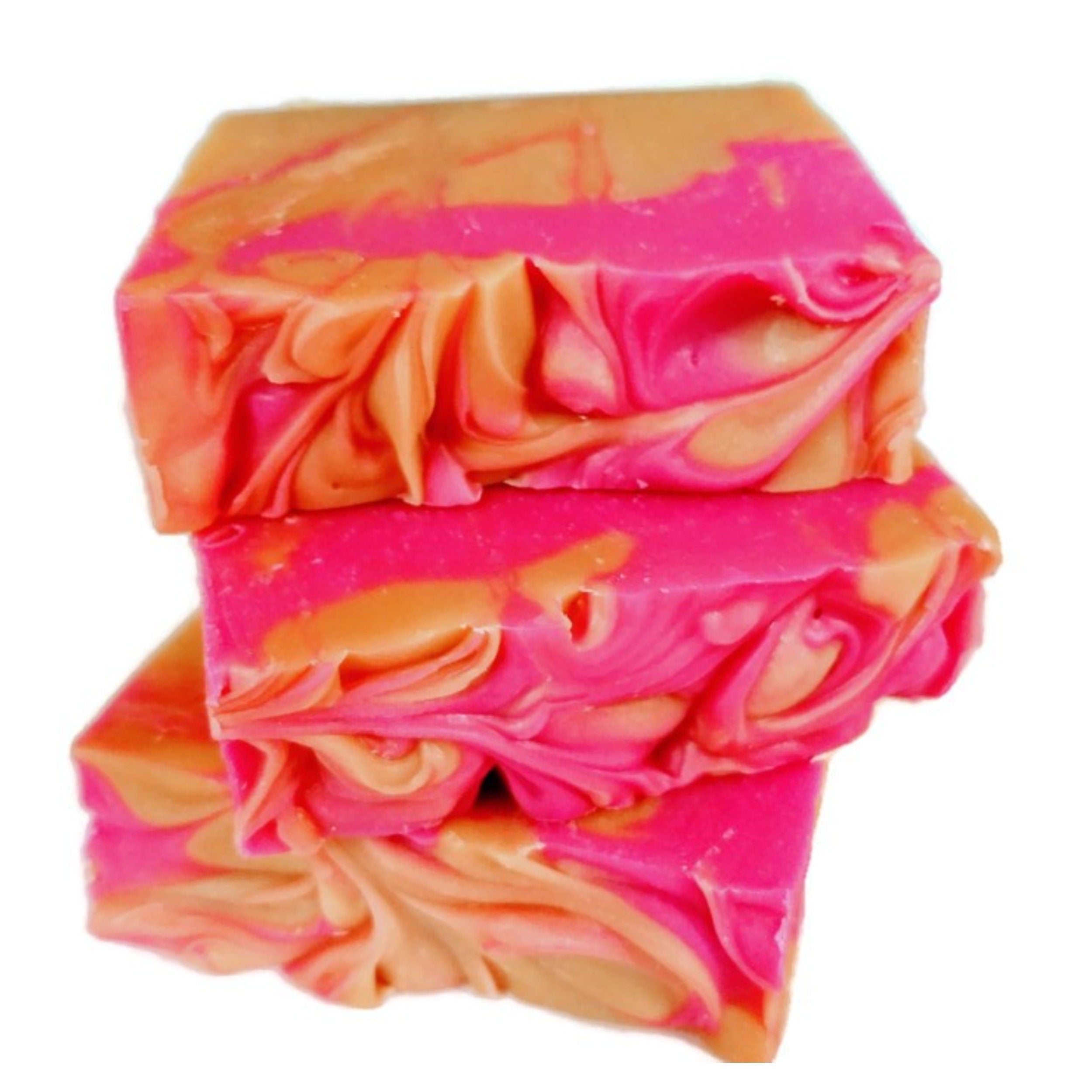 A vibrant Orange Blossom Soap bar with pink and orange swirls, showcasing its handcrafted design and tropical essence.