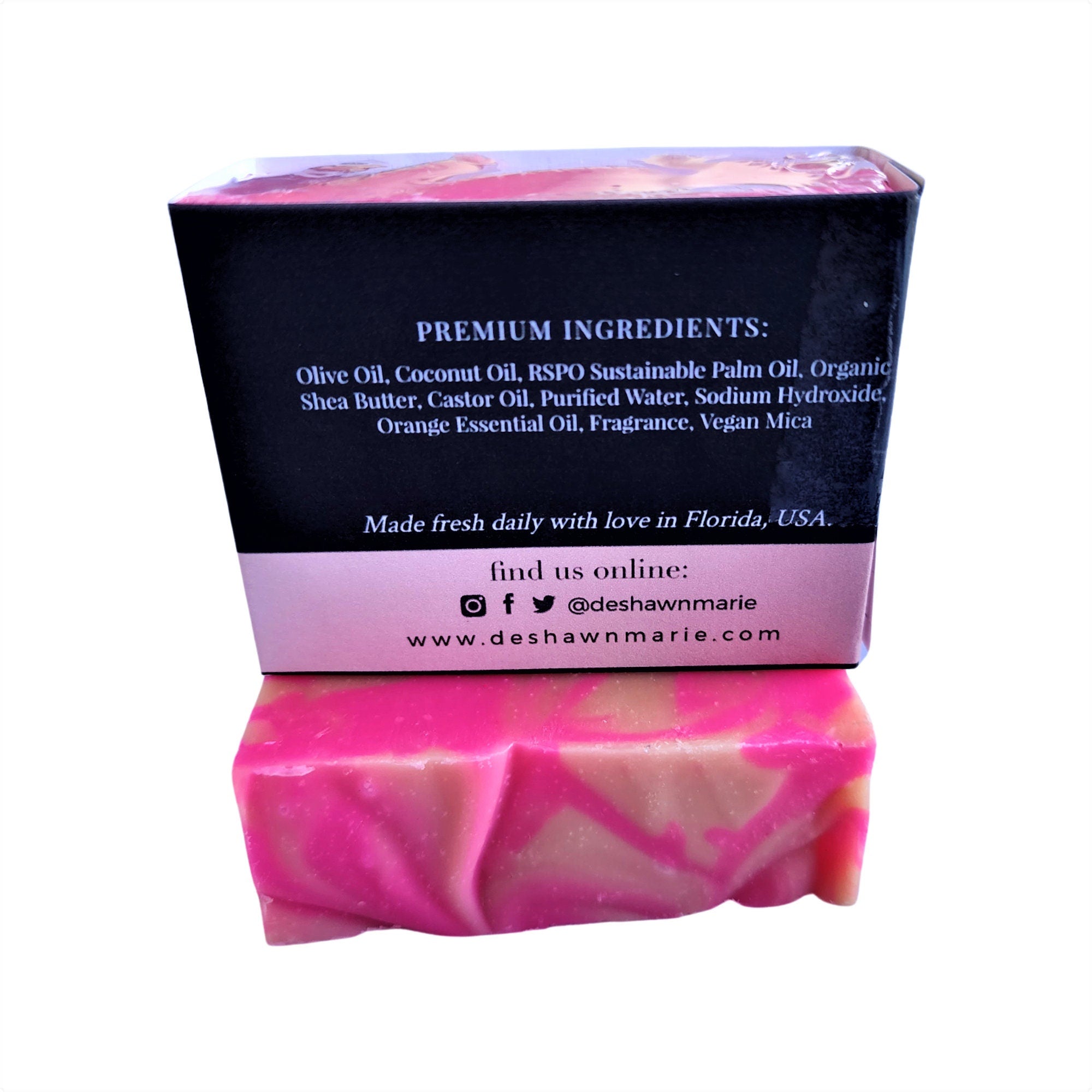 A vibrant Orange Blossom Soap bar with pink and orange swirls, showcasing its handcrafted design and tropical essence.