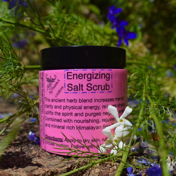 Organic Energizing Salt Scrub in a glass jar with Himalayan Sea Salt and herbal ingredients, showcasing its natural and vibrant texture.