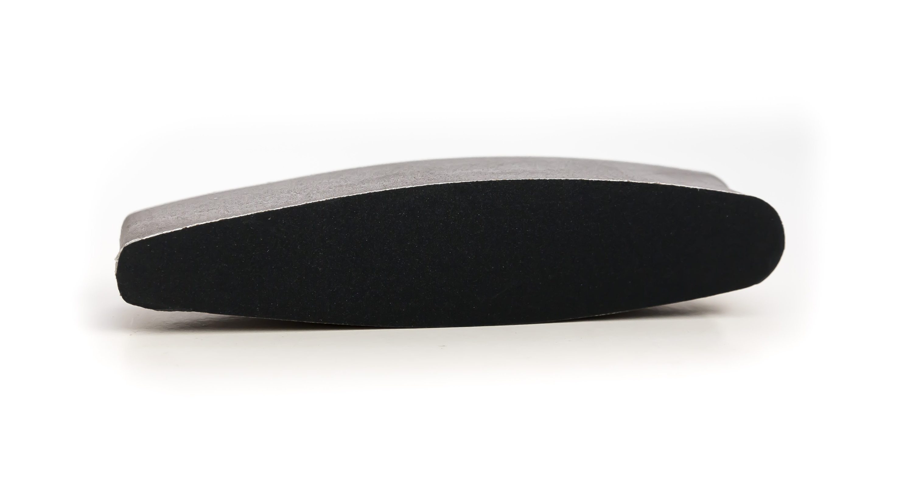 A medium grit oval nail file designed for shaping and repairing nails, featuring a sleek design and ergonomic grip.