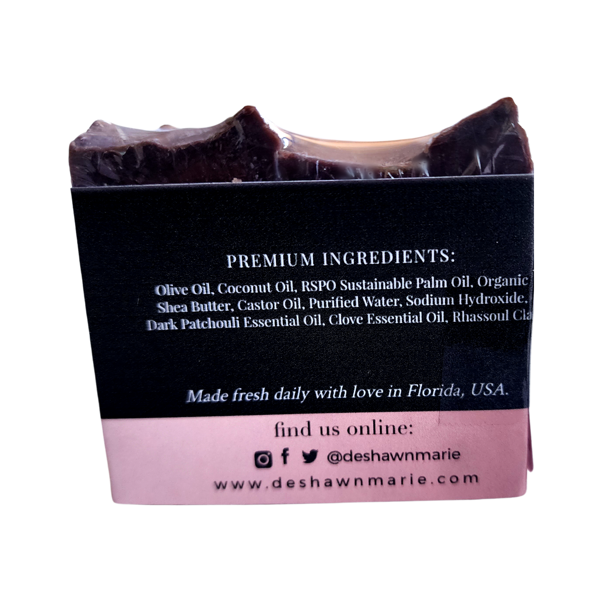 Patchouli Clove Soap bar with organic ingredients, showcasing its earthy color and texture.