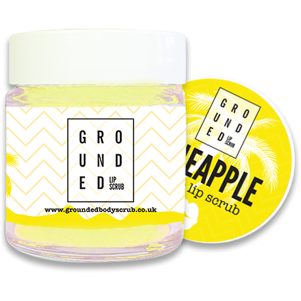 Grounded Pineapple Lip Scrub in a 30ml jar, showcasing its vibrant tropical packaging and texture.