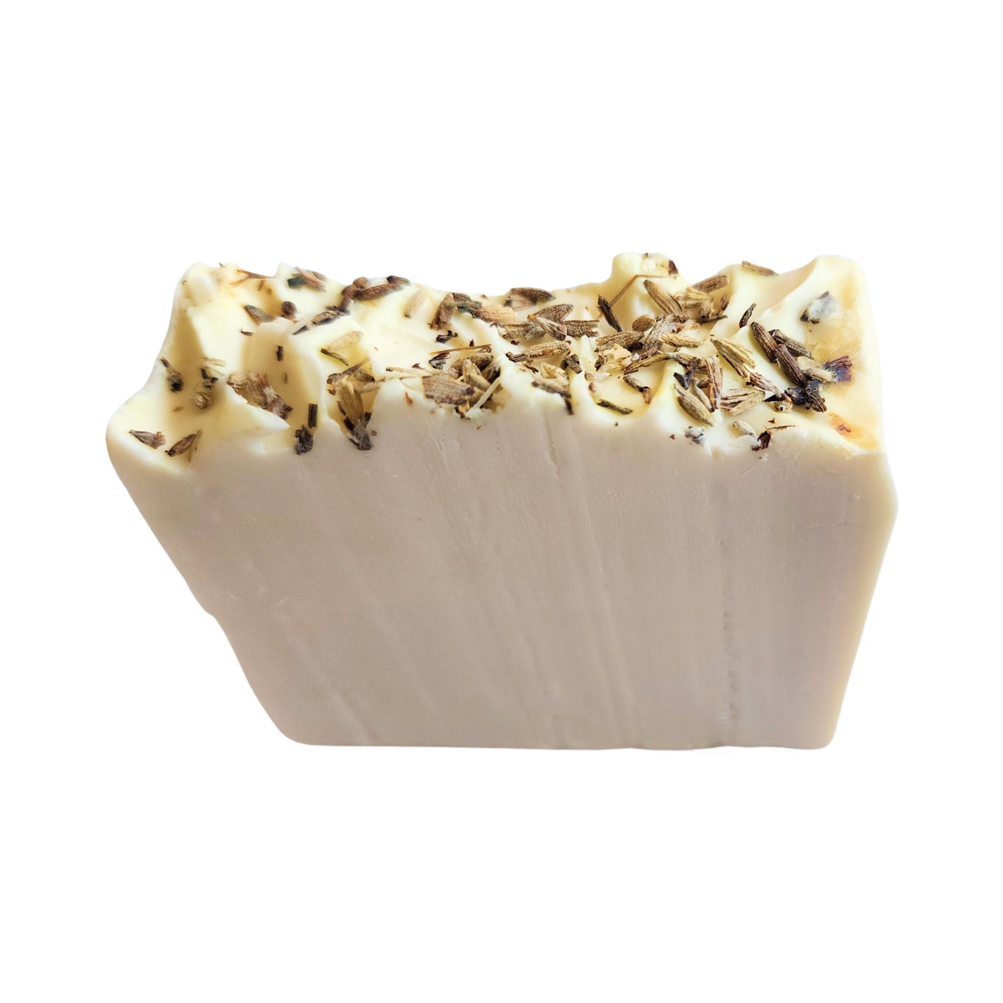 A beautifully crafted Pure Lavender Soap bar with lavender buds on top, showcasing its rich texture and vibrant color.