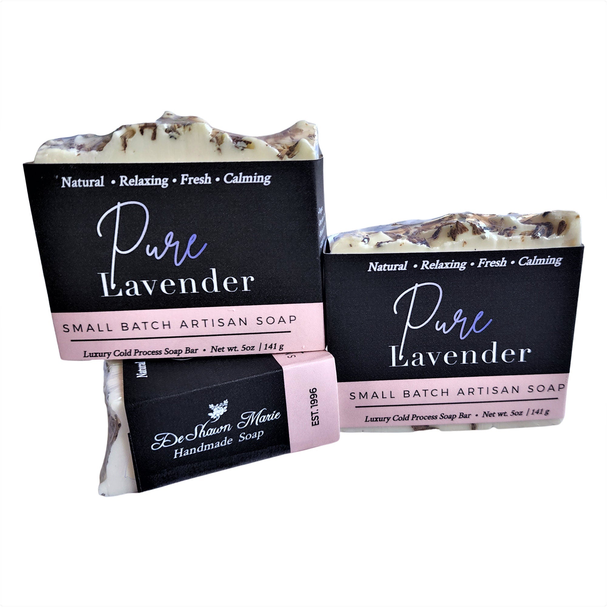 A beautifully crafted Pure Lavender Soap bar with lavender buds on top, showcasing its rich texture and vibrant color.