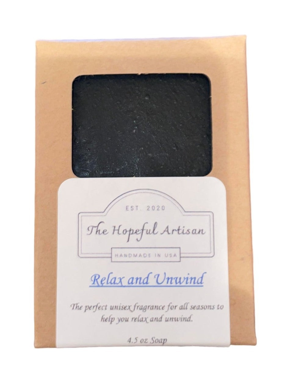 Relax and Unwind soap bar with Charcoal Aloe fragrance, showcasing unique swirls and natural ingredients.