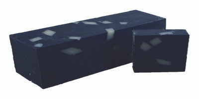 Relax and Unwind soap bar with Charcoal Aloe fragrance, showcasing unique swirls and natural ingredients.