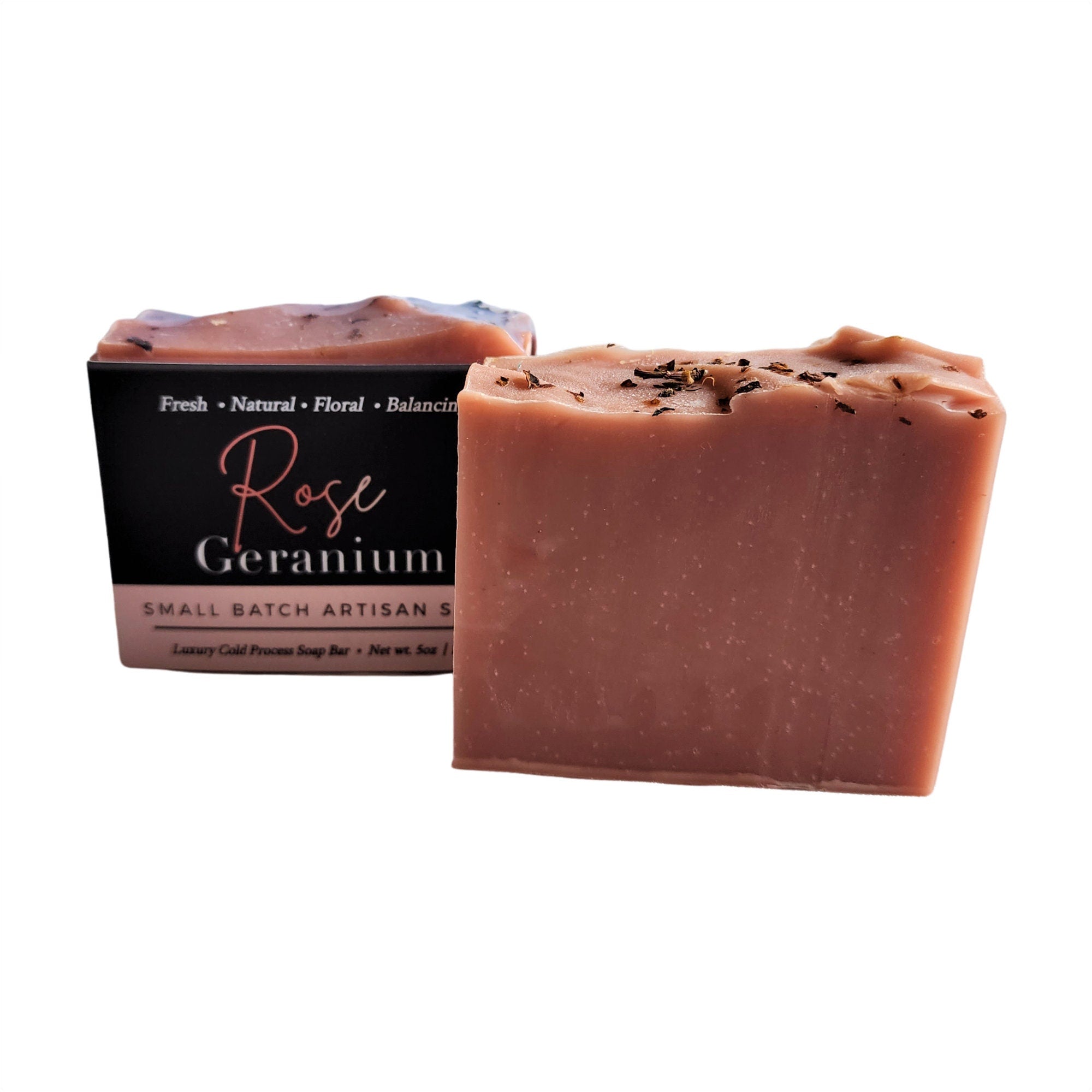 A beautifully crafted Rose Geranium Soap bar with pink clay and crushed rose petals, showcasing its delicate texture and vibrant color.