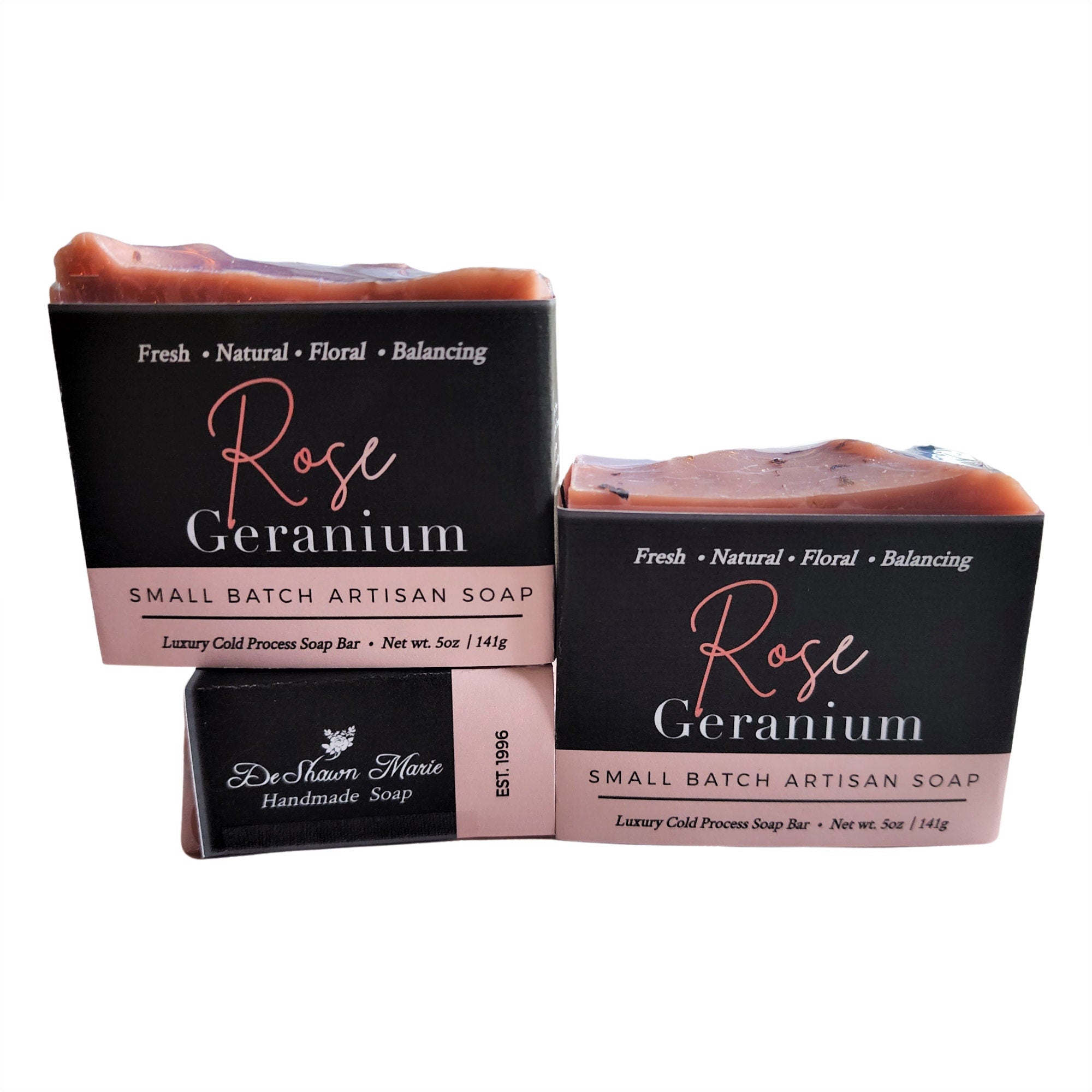 A beautifully crafted Rose Geranium Soap bar with pink clay and crushed rose petals, showcasing its delicate texture and vibrant color.