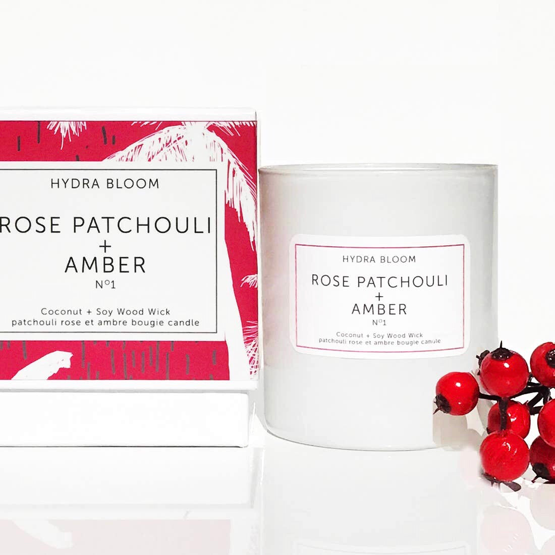 A beautifully crafted 8oz Rose, Patchouli & Amber natural candle with a wood wick, showcasing its elegant design and inviting fragrance.