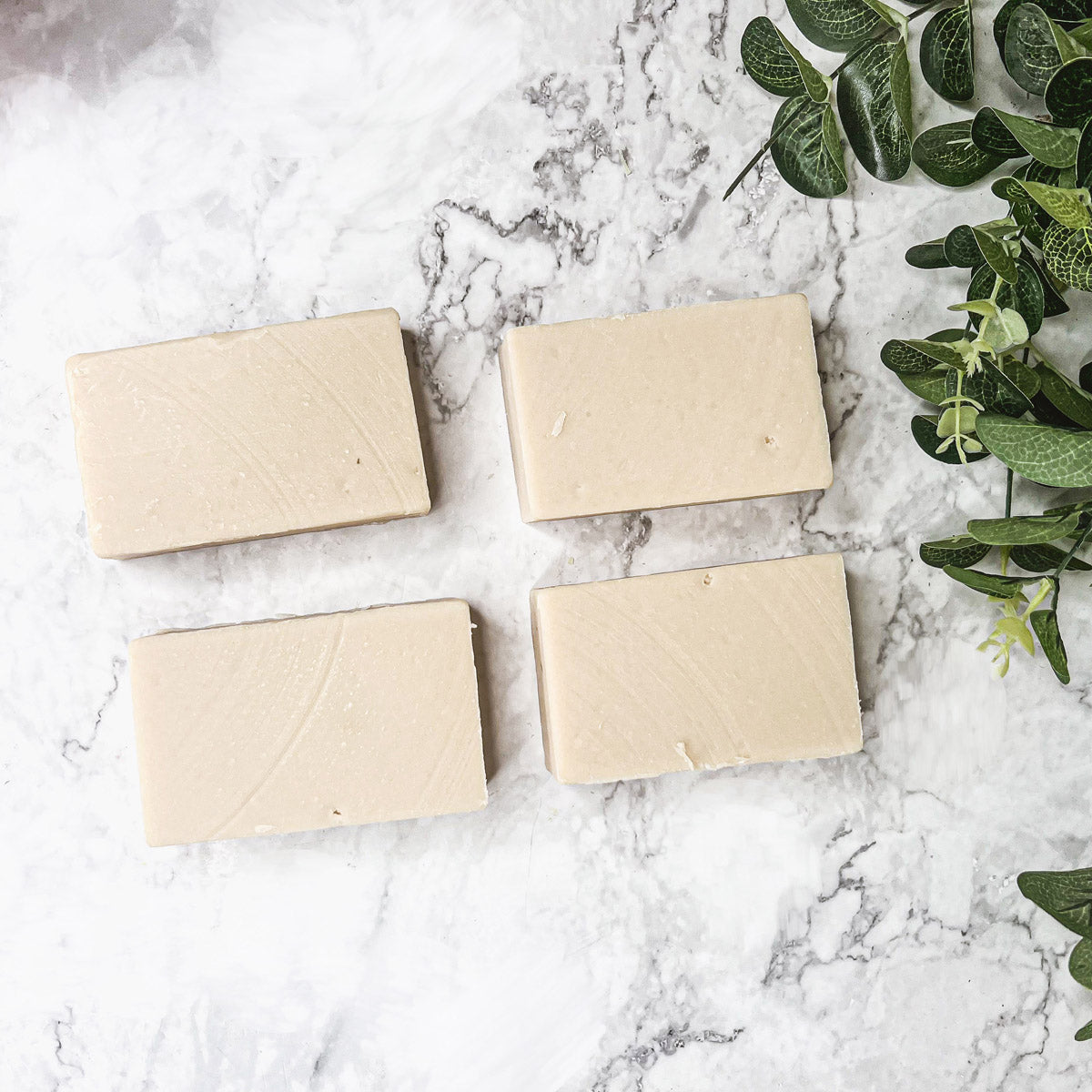 A bar of natural sandalwood soap showcasing its earthy color and texture, emphasizing its handcrafted quality and pure fragrance.