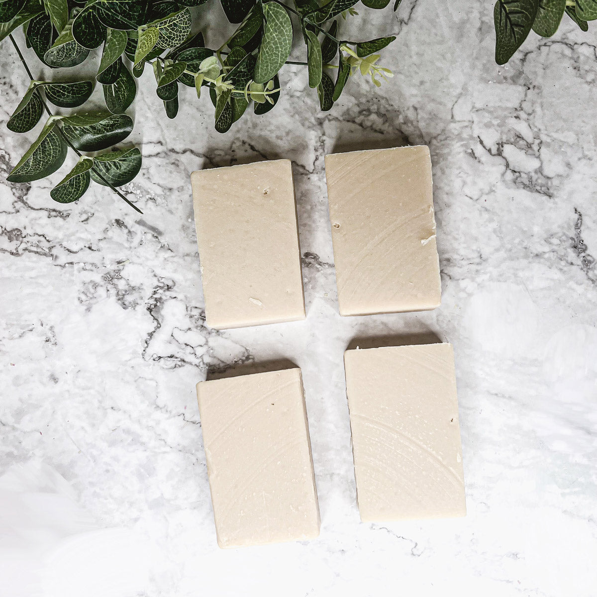 A bar of natural sandalwood soap showcasing its earthy color and texture, emphasizing its handcrafted quality and pure fragrance.