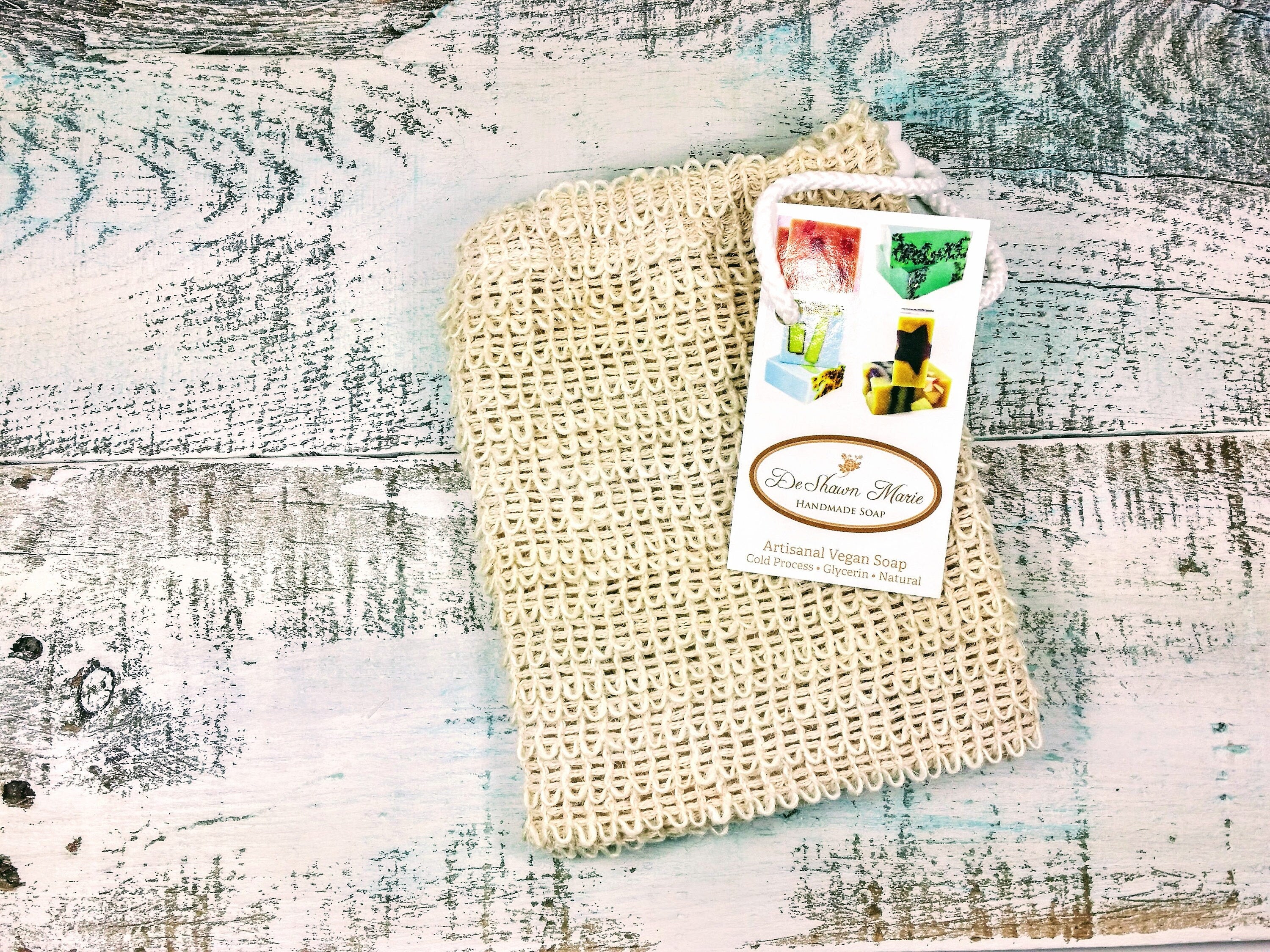 Natural sisal soap saver sack with drawstring, ideal for exfoliating and using leftover soap pieces.