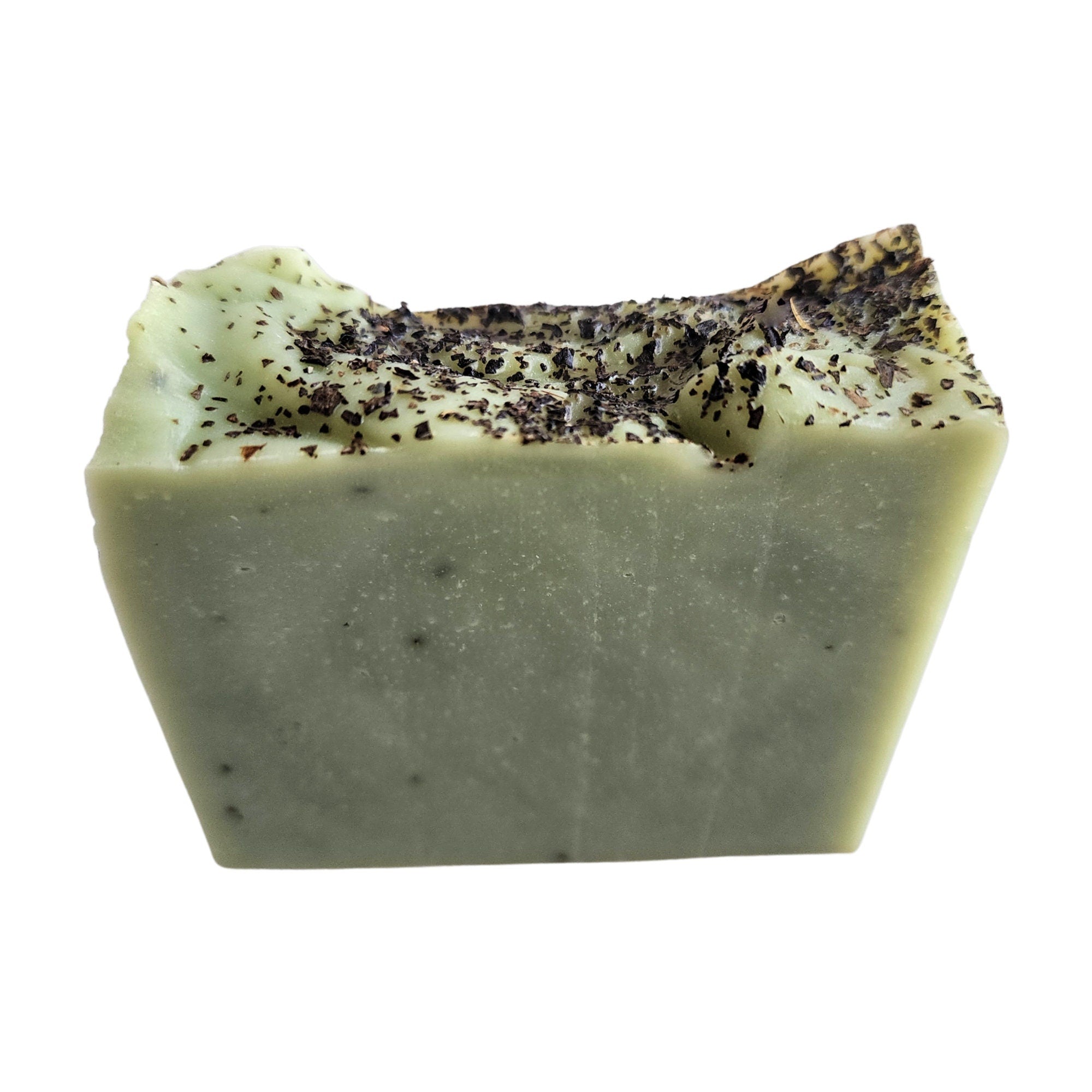 Spearmint Eucalyptus Soap bar with organic mint leaves, showcasing its vibrant green color and creamy texture.