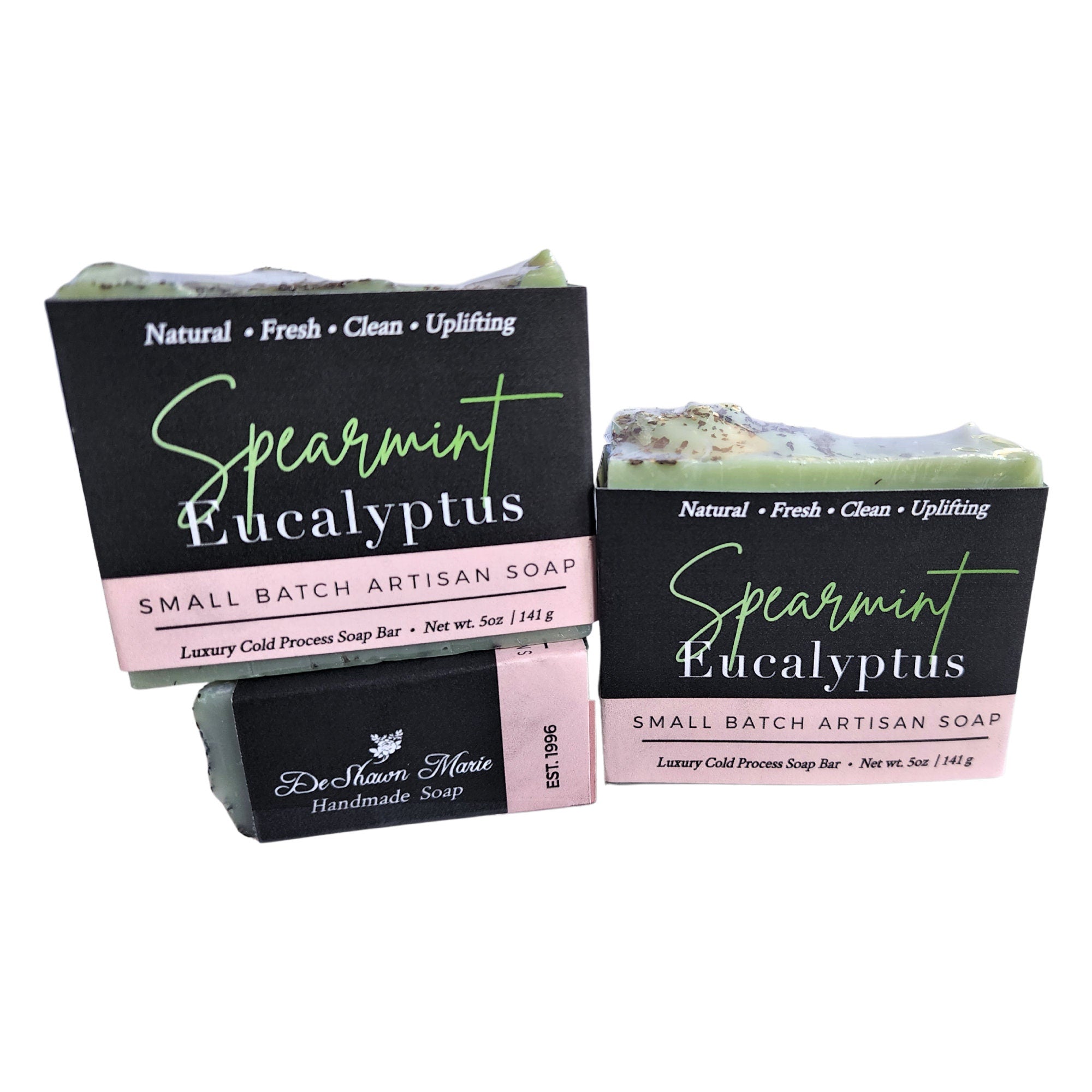 Spearmint Eucalyptus Soap bar with organic mint leaves, showcasing its vibrant green color and creamy texture.