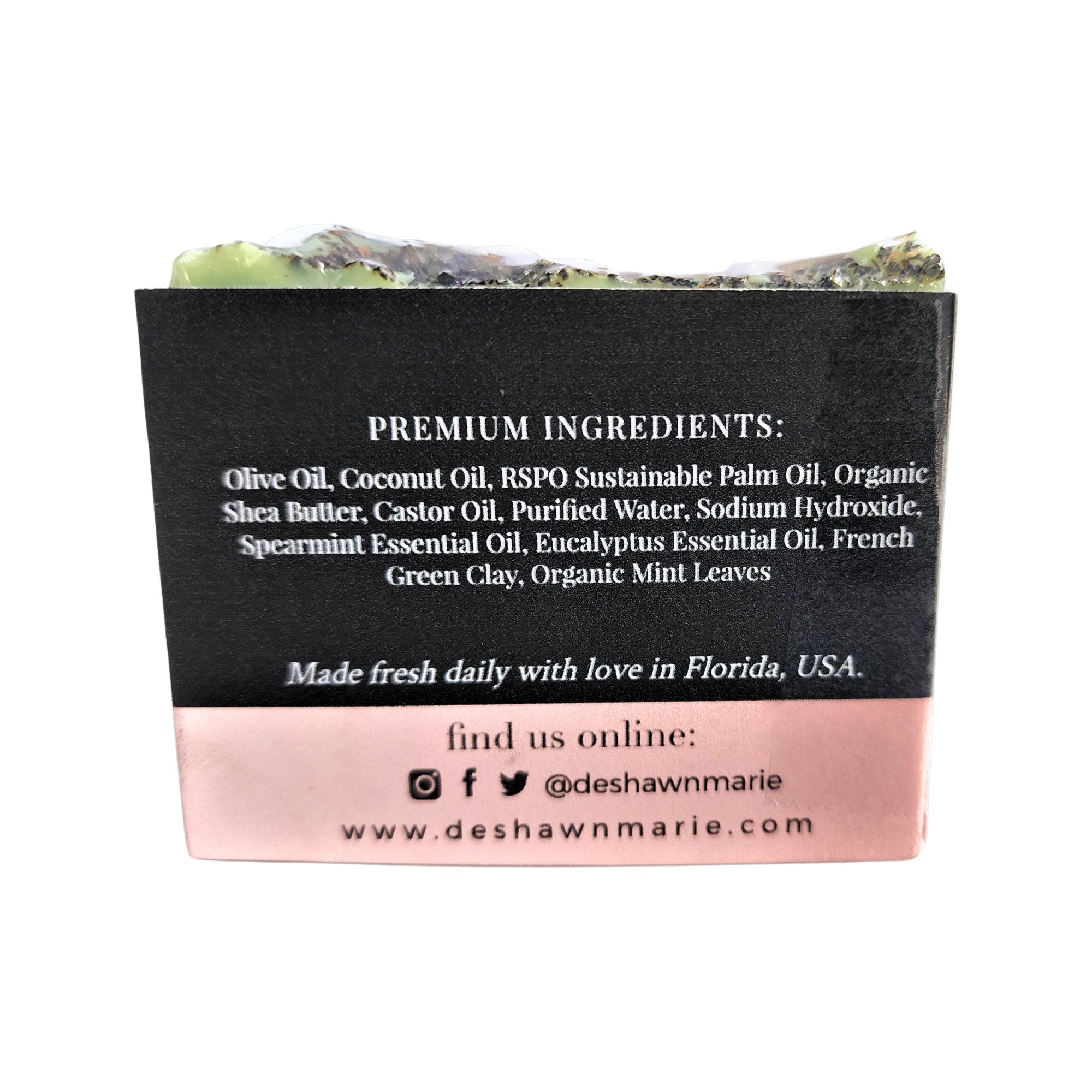 Spearmint Eucalyptus Soap bar with organic mint leaves, showcasing its vibrant green color and creamy texture.