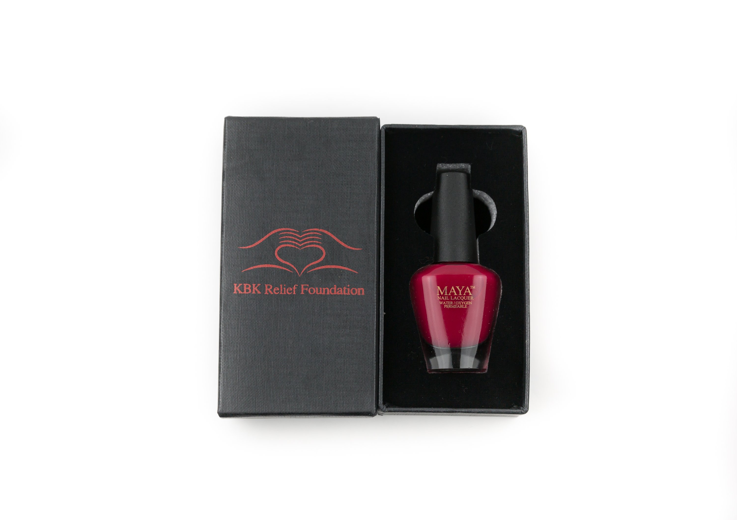 Special Edition KBK Charity Red nail polish in a customized box with a velvety insert, showcasing a classic cherry red shade.