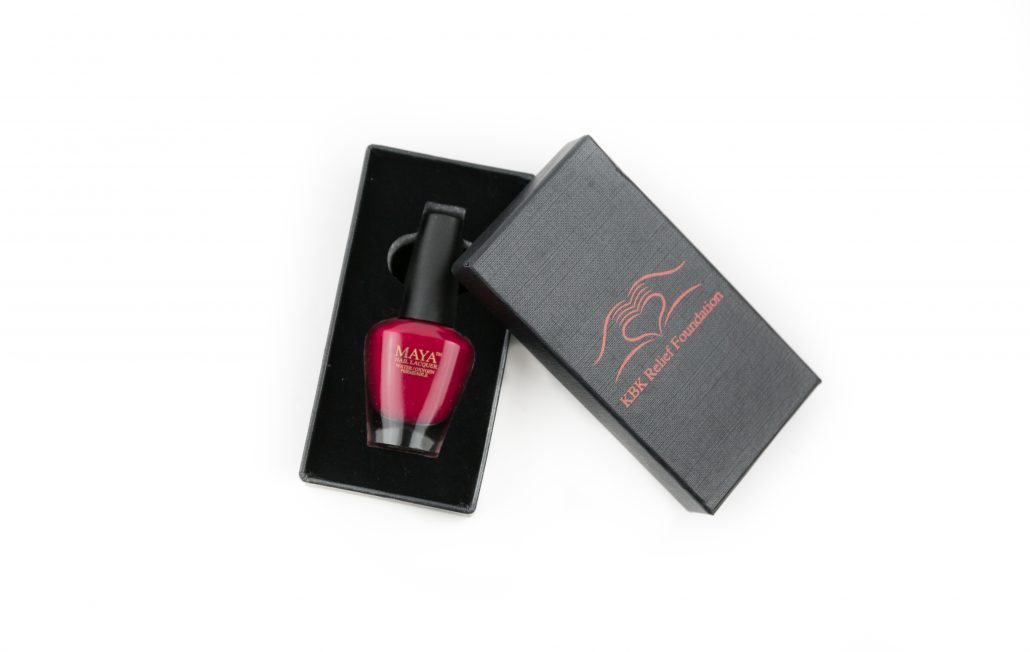 Special Edition KBK Charity Red nail polish in a customized box with a velvety insert, showcasing a classic cherry red shade.