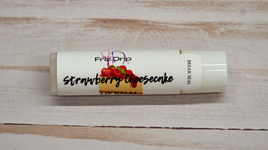 Strawberry Cheesecake Lip Balm in a sleek tube, showcasing its creamy texture and vibrant packaging, perfect for moisturizing lips.